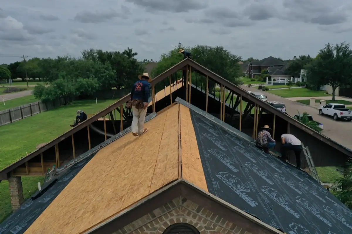 Texas Contractors crew replacing roof decking and underlayment during a full roof replacement in the Rio Grande Valley