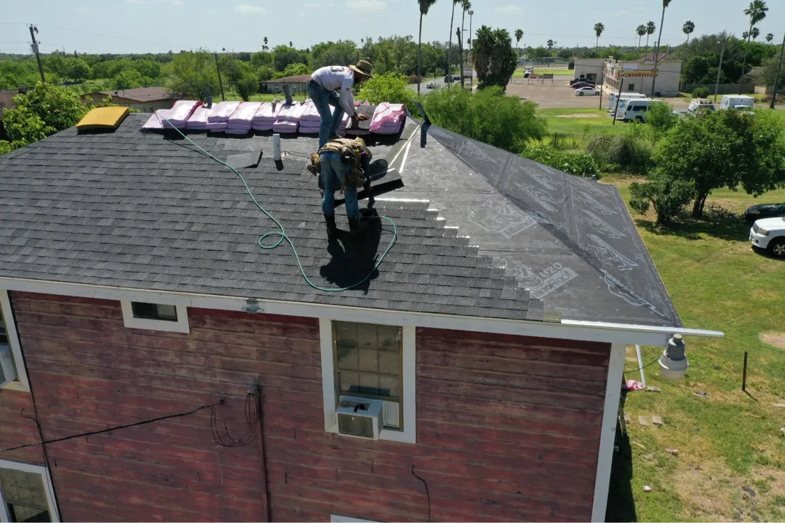 Crew installing a new roof on a home in Mission
