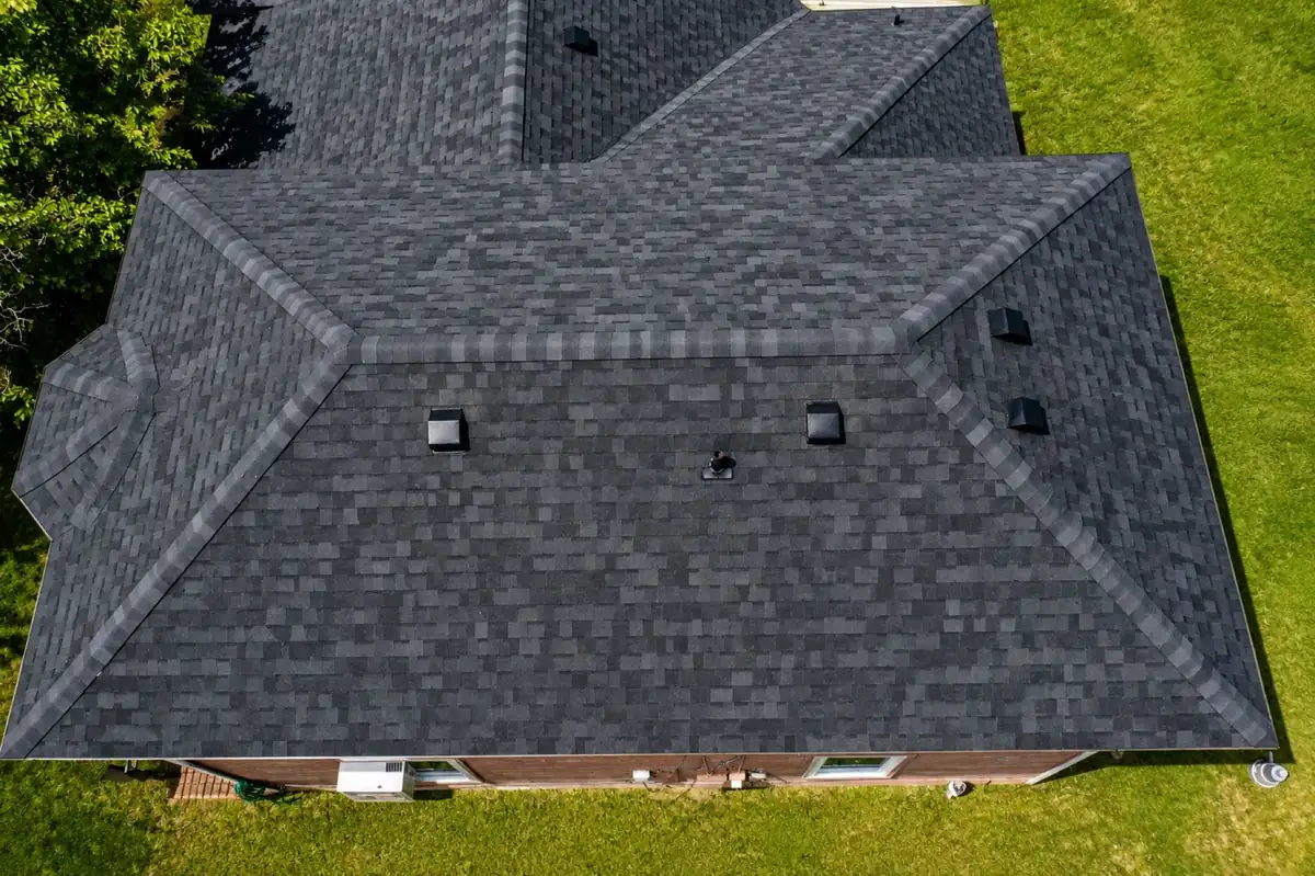 Drone view of the completed charcoal architectural shingle roof replacement in Mission, Texas